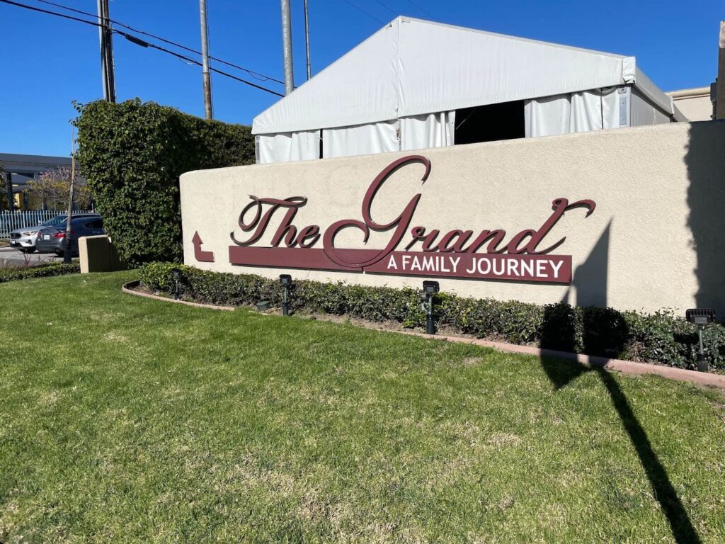 Outdoor sign for The Grand hotel in Long Beach CA