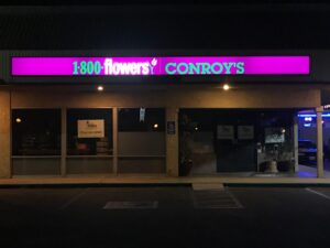 a light-up box sign advertising 1-800-flowers