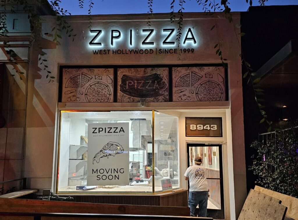 Z Pizza sign illuminated at night and outdoors