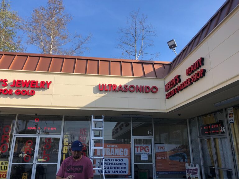 daytime exterior red channel letters on storefronts