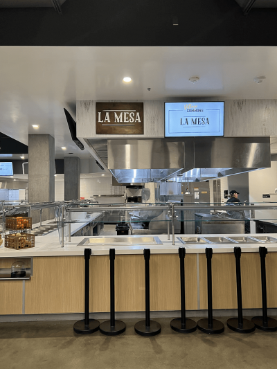 a mounted sign in a kitchen area reading la mesa