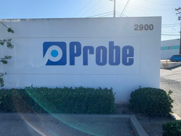 A monument sign marking the location of Probe Holdings, Inc. in Long Beach.